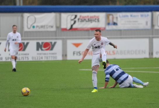Ryan Strachan in action for Cove.