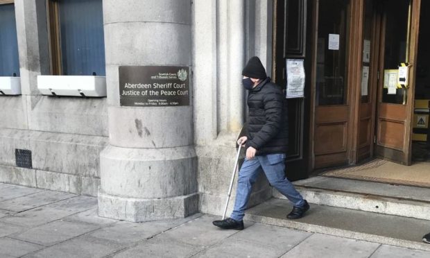 George McIntosh leaving Aberdeen Sheriff Court