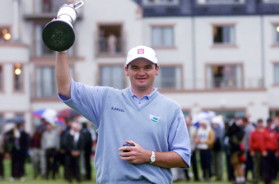 Scotland's Paul Lawrie holds the Claret Jug aloft after winning the 1999 Open Championship at Carnoustie, following a play-off with Justin Leonard and Jean Van De Velde.