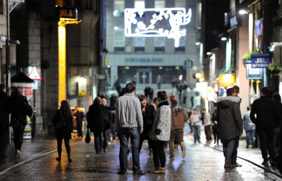 Revellers on Belmont Street. Picture by Kami Thomson.