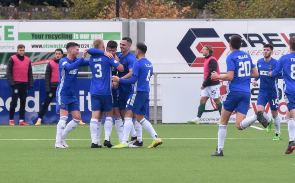 Cove celebrate Dan Higgins' goal.
Picture by Paul Glendell