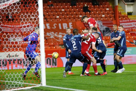 Tommie Hoban heads home Aberdeen's opener against Hamilton
