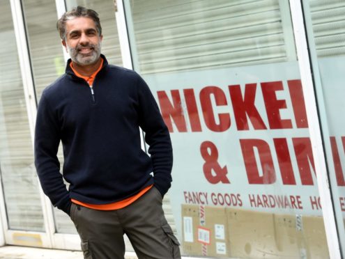 Naeem Ahmed outside the new shop