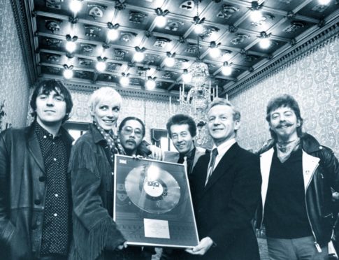 Aberdeen's home-grown superstar Annie Lennox and her then band, The Tourists, receive a silver disc from Lord Provost William Fraser at the Town House in 1980. It was for sales of the band's album, Reality Effect. Left to right are Peter Coombes, Annie, Eddie Chin, Jim Tooley, Lord Provost Fraser and Dave Stewart.