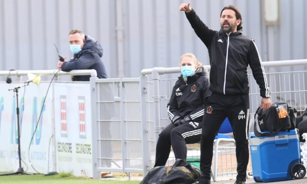 Paul Hartley on the touchline.