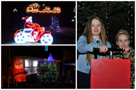 Mya Leone and Alicia Troup switch on the Ellon Christmas tree light in the town centre. Picture by Paul Glendell.
