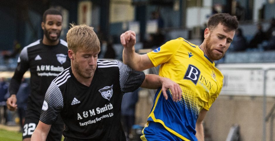 Peterhead's Kieran Freeman and Guy Elhamed during a Betfred Cup match between Peterhead and St Johnstone.