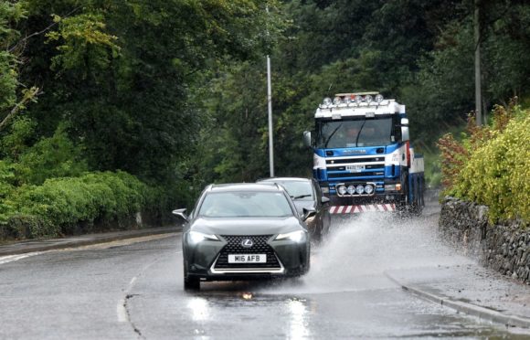 Heavy rain could cause flooding on roads.