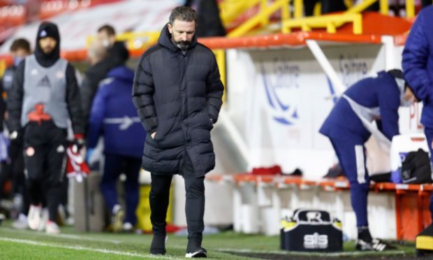 Aberdeen manager Derek McInnes looks dejected after the clash with Dundee United.