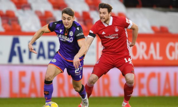Aberdeen's Ash Taylor battles with Dundee United's Louis Appere