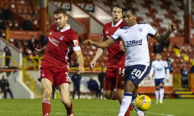 Aberdeen defender Tommie Hoban battles with Rangers' Alfredo Morelos.