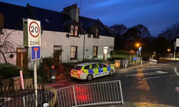 Police presence outside a house in Peterculter