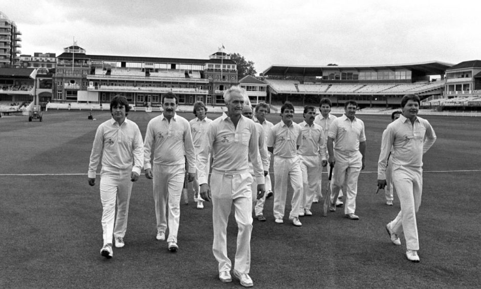 Brian, second from left, walking behind his dad as the Freuchie team became heroes in 1985.
