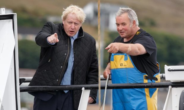 Boris Johnson points out the lost city of gold to skipper Ronnie Norquoy. Maybe.