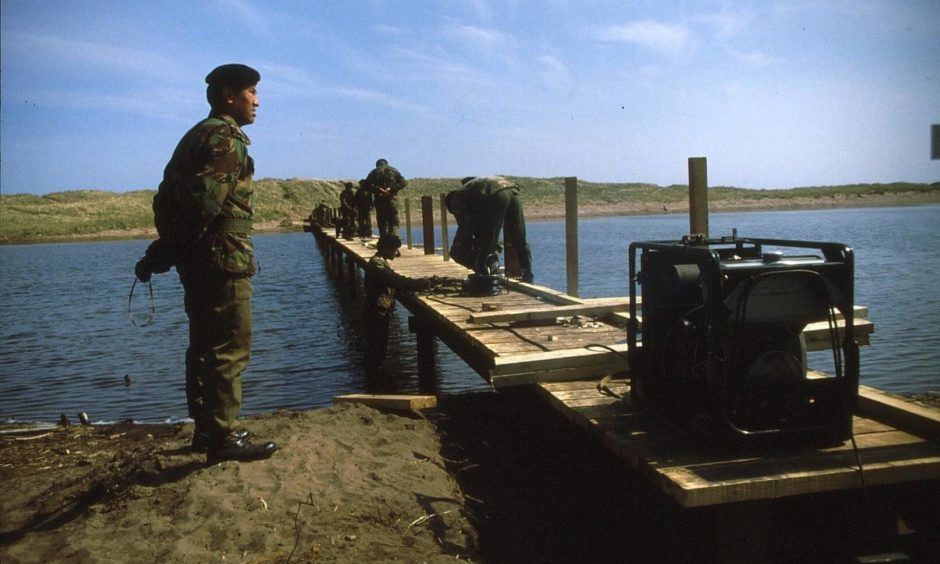 The bridge over the salt marsh at St Cyrus National Nature Reserve takes shape in 1985, courtesy of Gurkha engineers.