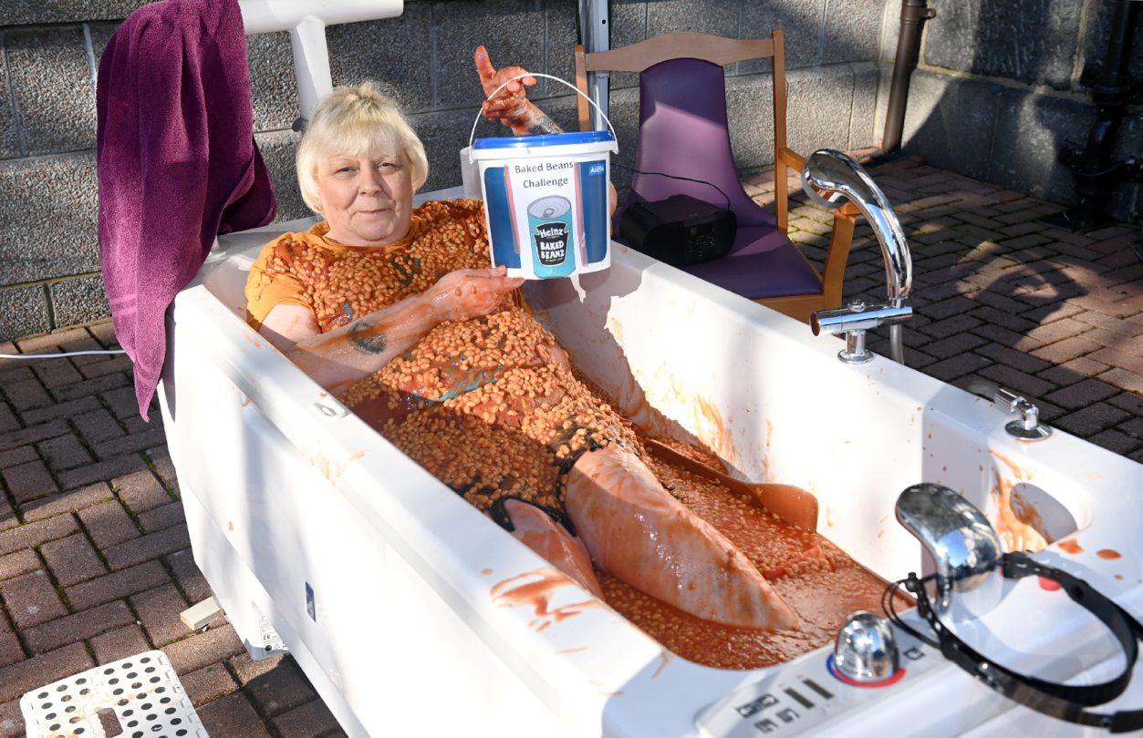 Watch: Aberdeen woman sits in bath of baked beans to raise funds for care home - Vimarsana News