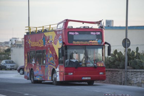 The sightseeing tour bus after the collision.