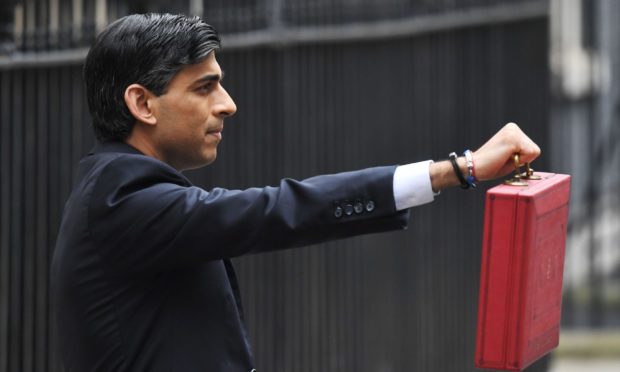Rishi Sunak, Chancellor of the Exchequer, leaves No.11 Downing Street, ahead of delivering his budget.