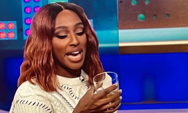 Alexandra Burke samples the whisky.