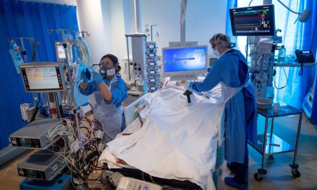 A patient on an ECMO machine at the Royal Papworth Hospital, Cambridge.