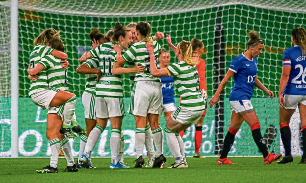 Mariah Lee celebrates her goal against Rangers with her Celtic team-mates.