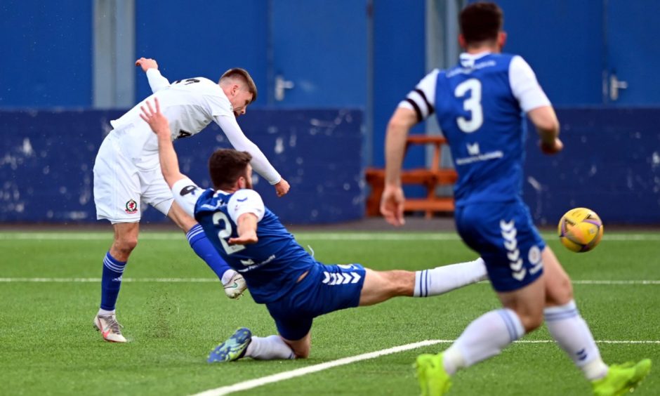 Connor Smith shoots for goal during Cove Rangers' game with Montrose.