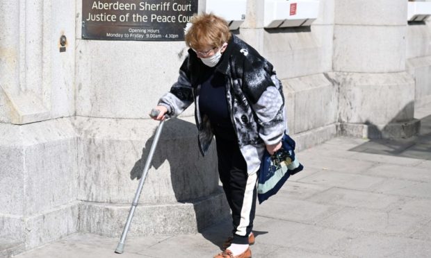 Agnes Gibb or Clark outside court.