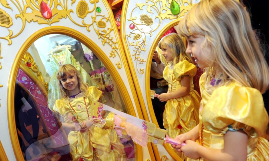 Abigayle Morrison looks at the fairy mirror in the new Disney Store in the Bon Accord Centre.
Picture by KEVIN EMSLIE