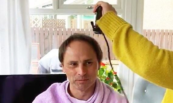 Dave getting his haircut moments before his RNLI pager went off.
