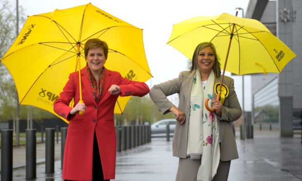 Nicola Sturgeon poses with Kaukab Stewart after Stewart was elected as the MSP for Glasgow Kelvin constituency.