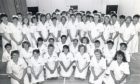 福雷斯特希尔学院的一群护士学生脸上挂着微笑，他们已经完成了期末考试