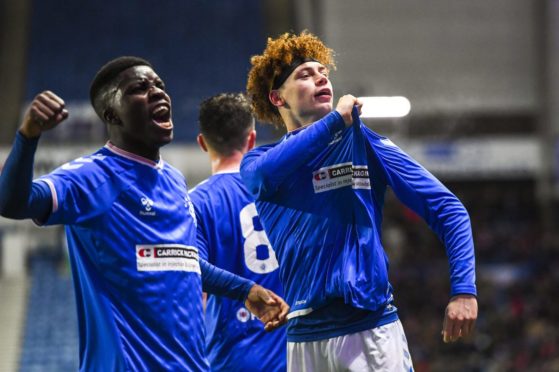 Nathan Young-Coombes celebrates after scoring for Rangers colts against Wrexham in the Challenge Cup.