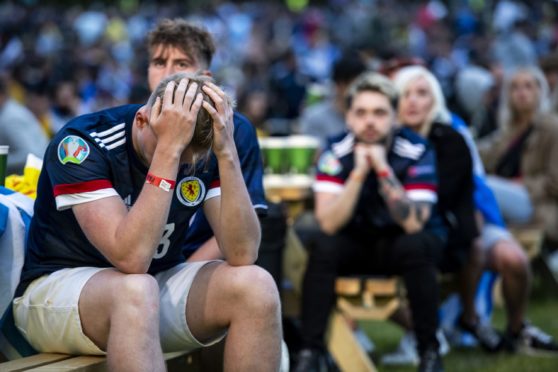 A dejected Scotland supporter at the Euro Fan Zone during Scotland's Euro 2020 campaign