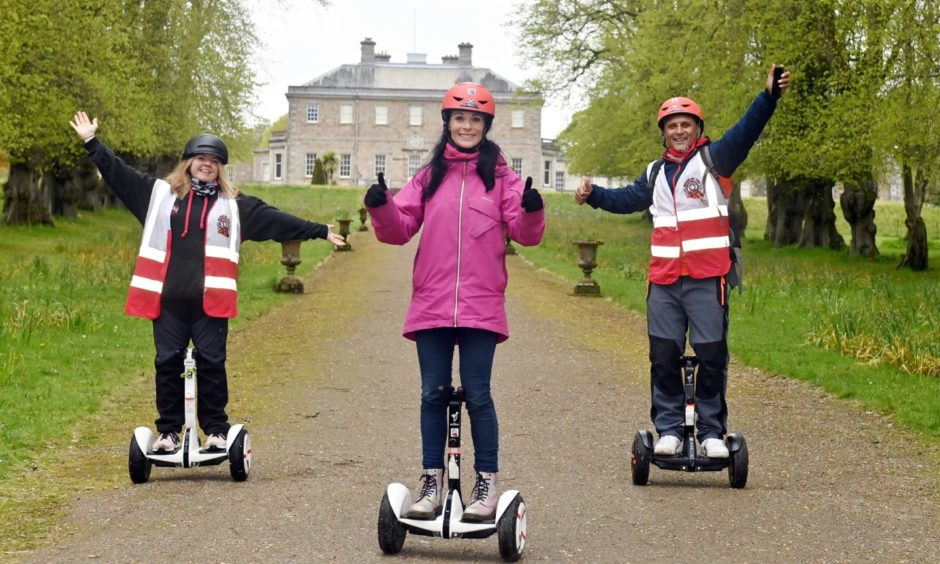 Gayle Ritchie centre, with Wheelie Fun owners Claire and Merv Christie.