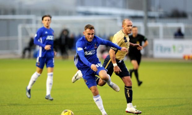 Cove's Sebastian Ross darts past Forfar's Gary Irvine.