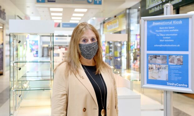 Linda Stewart, Trinity Centre general manager in front of the promotional kiosks.