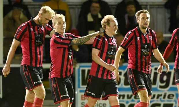 Inverurie players celebrate their second goal in the Aberdeenshire Shield tie against Fraserburgh