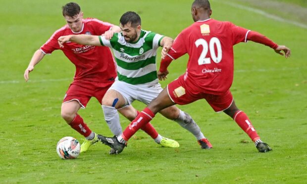 Brechin's Kieran Inglis and Julian Wade close in on Buckie's Andrew MacAskill.