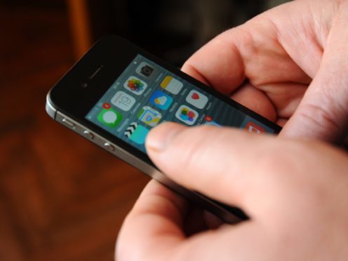 A man using an Apple iPhone (Lauren Hurley/PA)