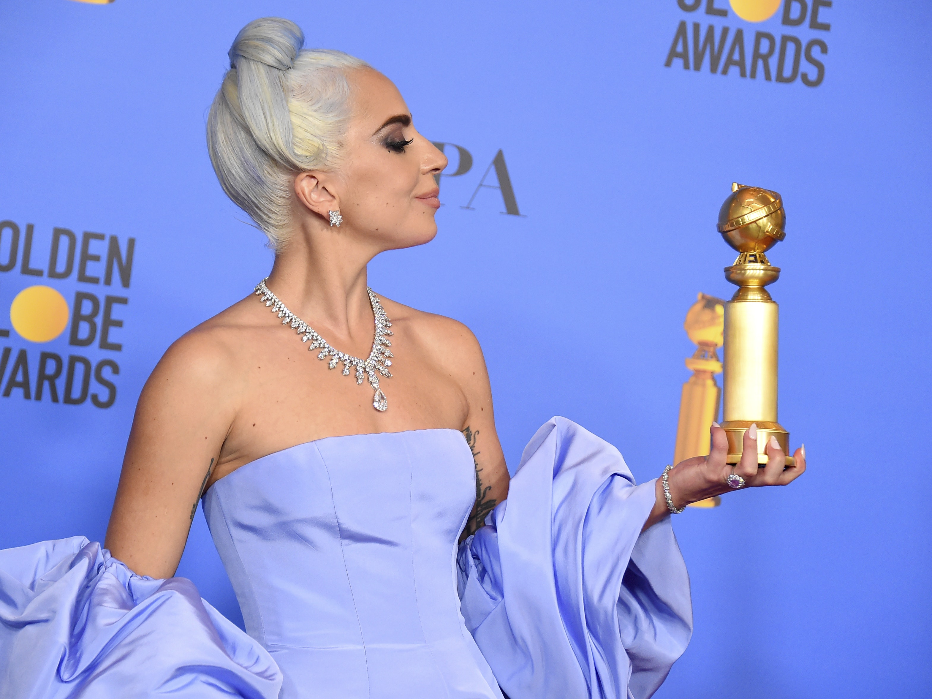Lady Gaga pays tribute to Bradley Cooper as she picks up best song Golden Globe ...