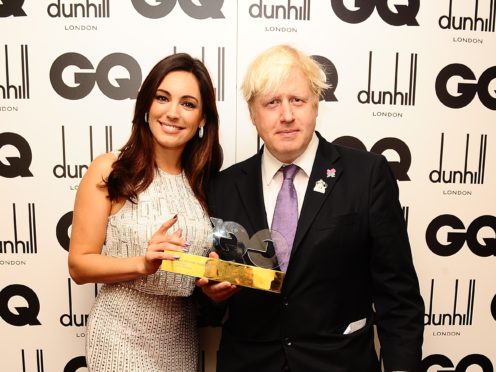 Kelly Brook with Boris Johnson at the 2012 GQ Men Of The Year Awards (Ian West/PA)