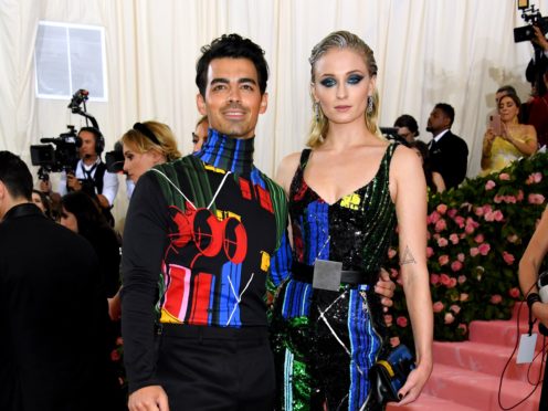 Game Of Thrones star Sophie Turner has shared a picture of her and new husband Joe Jonas walking down the aisle (Jennifer Graylock/PA)
