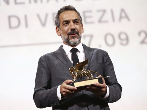 Todd Phillips holds the Golden Lion for Best Film for Joker (Joel C Ryan/Invision/AP)
