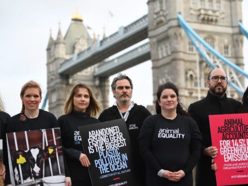 Actor Joaquin Phoenix after supporting the unfurling of a banner on Tower Bridge (Victoria Jones/PA)