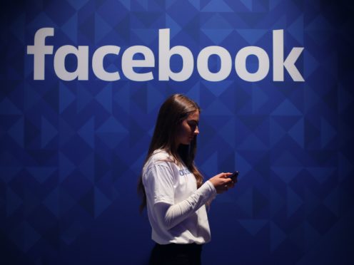 An optional survey will appear at the top of users’ News Feeds (Niall Carson/PA)