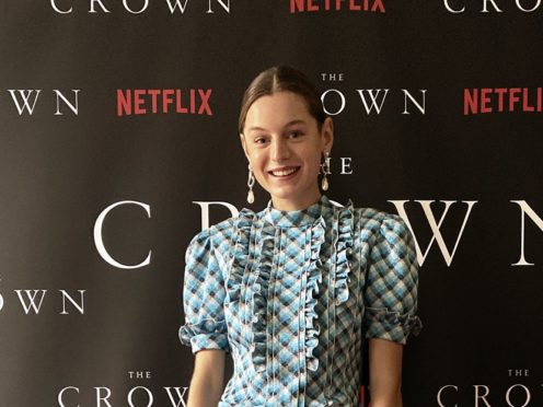 The Crown star Emma Corrin said her own early experiences with fame gave her an insight into Diana, Princess of Wales’ life in the spotlight (Netflix/PA)