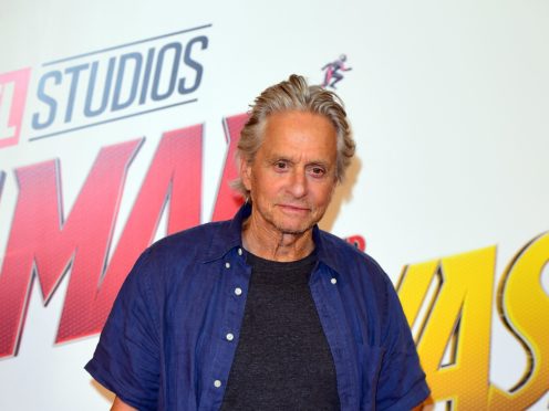 Michael Douglas cradled his month-old grandson as he met him for the first time (Ian West/PA)