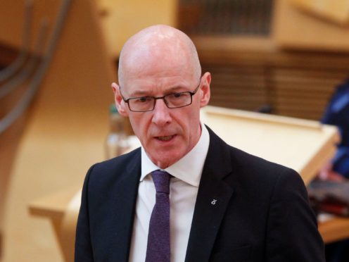 John Swinney said progress to close the attainment gap was made harder by the pandemic (Scottish Parliament/PA)