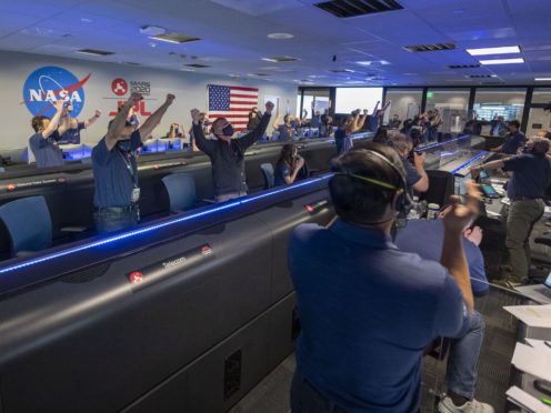 Nasa scientists cheering the conformation that the Mars Perseverance rover touched down on the red planet (Nasa)