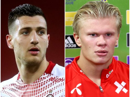 Diogo Dalot and Erling Haaland (Martin Rickett/Liam McBurney/PA)